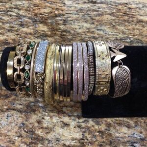 Lot of 17 gold tone bracelets. All in good shape